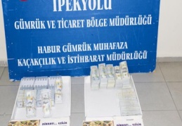 Baklava kutularından dolar çıktı