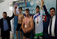Bedensel ve işitme engeliler yüzme sporcularından Kerem Özer birinci 