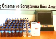Bir ev ve bir işyerine kaçak alkol operasyonu